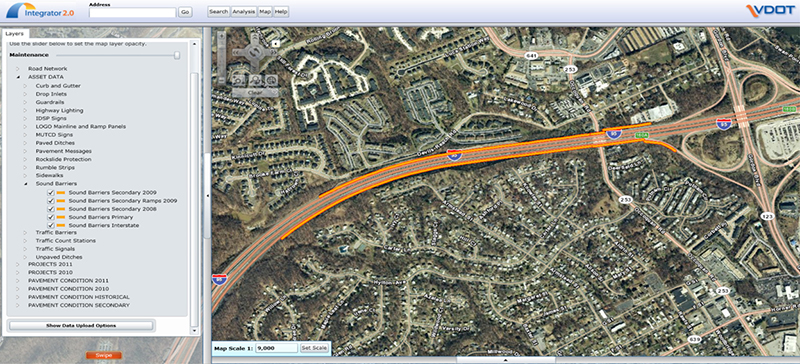 Screenshot of Integrator's Noise Wall Layer showing an aerial photograph of a highway section which has some edges colored orange to signify sound barrier locations