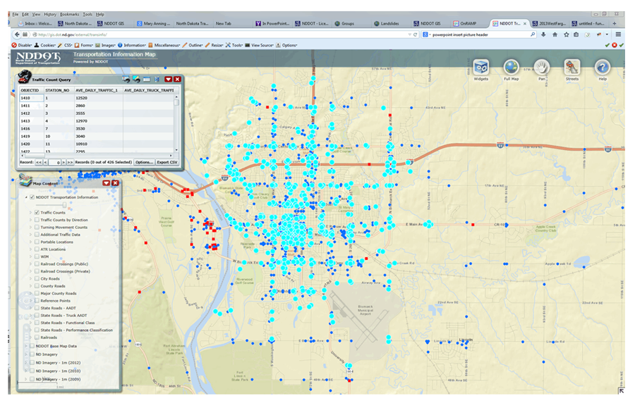 Screenshot from NDDOT's Transportation Information Map showing a close up map of Bismarck marked with colored circles and squares to show traffic count levels