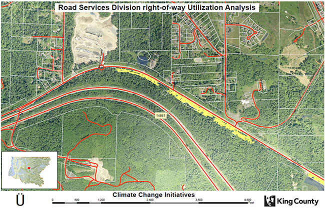 Topographical map of a section of King County with some roads lined in red and potential carbon sequestration sites higlighted in yellow along one major road