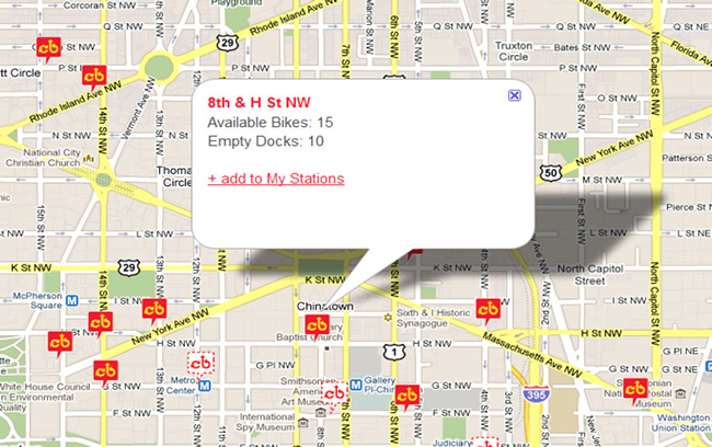 A screenshot from the Capital Bikeshare tool, showing a Google street map of a section of Washington DC, plotted with markers that show BikeShare stations. A Bikeshare station marker in Chinatown has been clicked on, which has caused a text box popup to display with the following information: location, available bike quantity, empty dock quantity, and a link to allow the user to 'add to My Stations.'